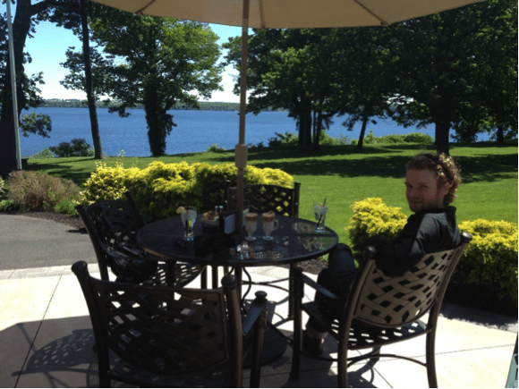 Big Mr. sitting at picnic table by lake