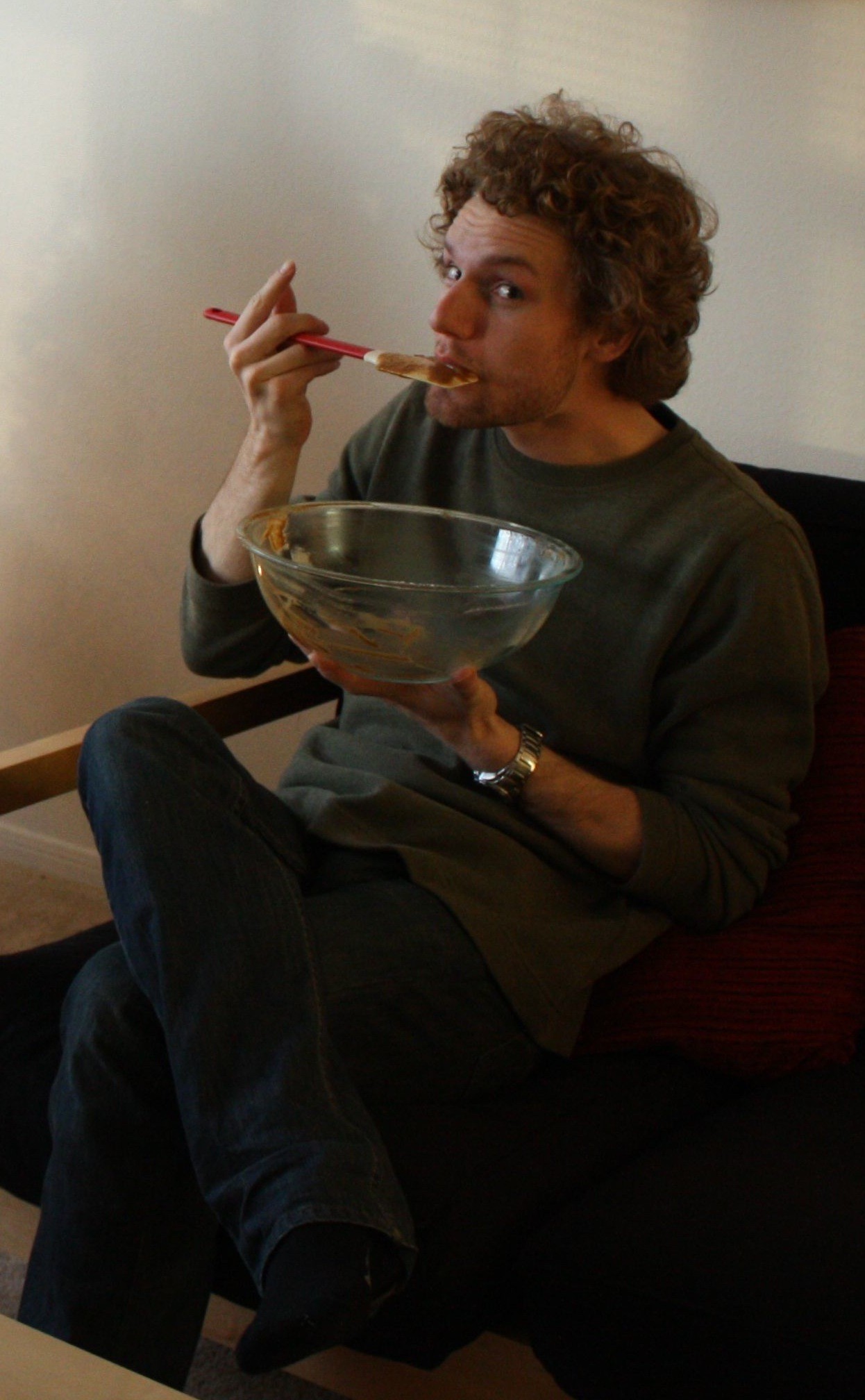 Big Mr. eating batter from a mixing bowl