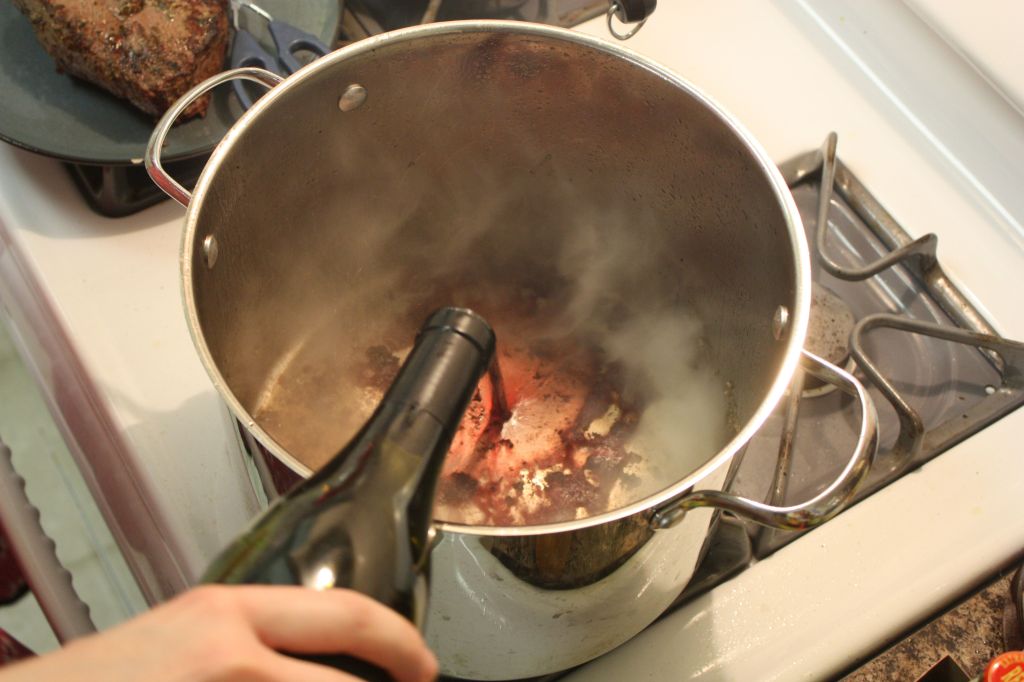 Wine being pored into a saucepan
