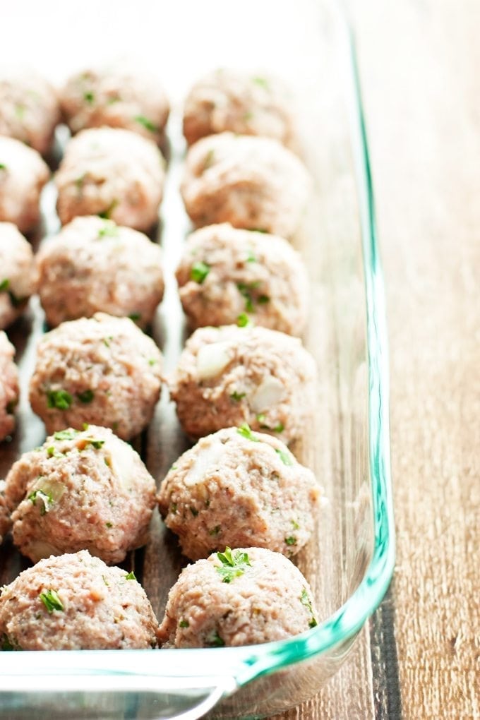 baked turkey meatballs in pan ready to be cooked