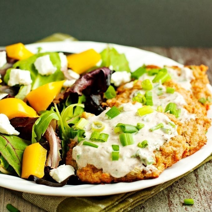 Baked crab cakes served with salad.