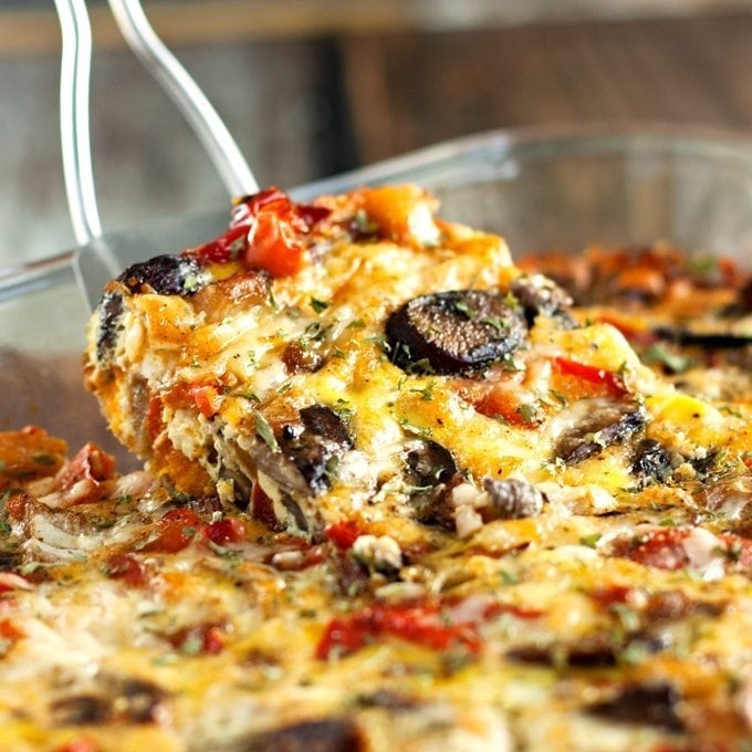 Egg bake piece being lifted from the baking dish