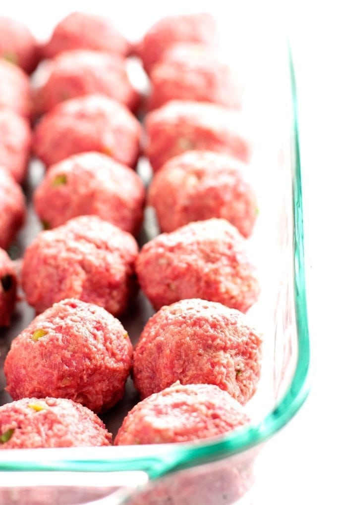 beef teriyaki meatballs in baking dish before they are cooked.