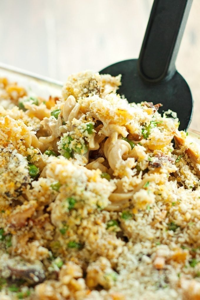 chicken tetrazzini being served with a spatula out of the baking dish