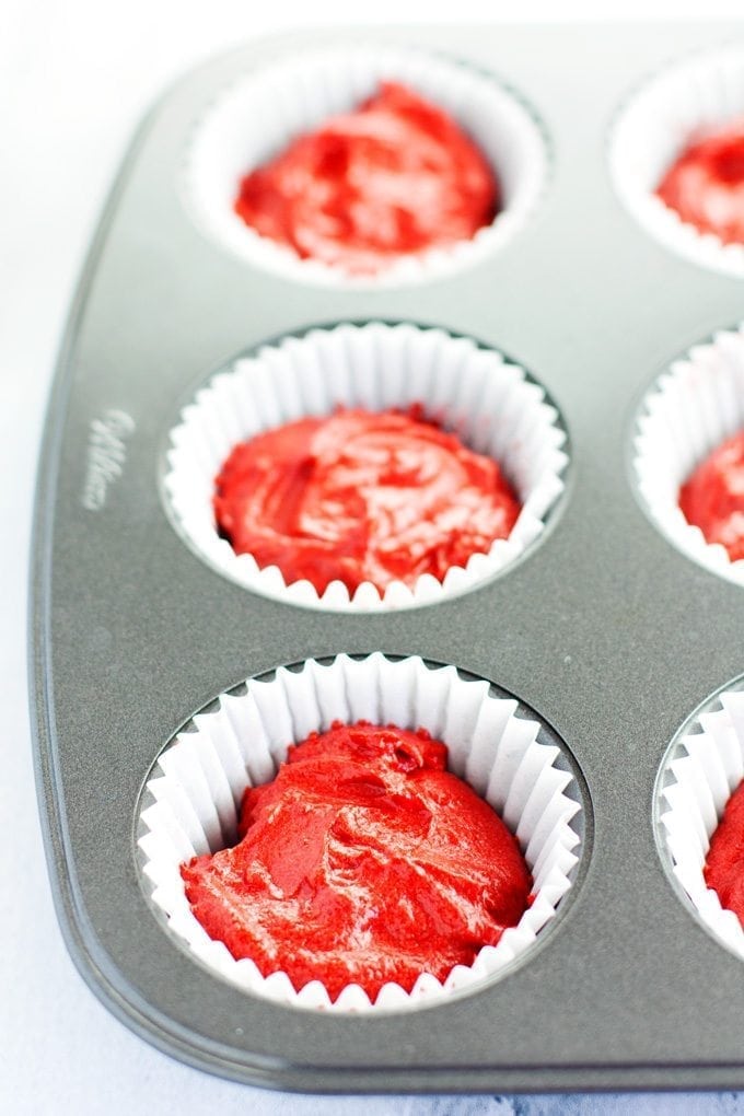 muffin tin of red velvet cupcake batter