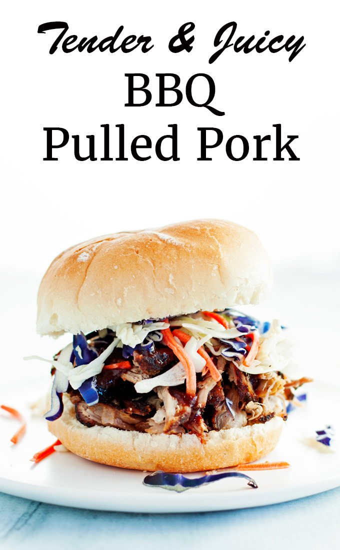 tender juicy bbq pulled pork sandwich on a toasted bun topped with colorful purple cabbage and shredded carrots